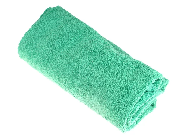 Зеленое полотенце на белом фоне — стоковое фото