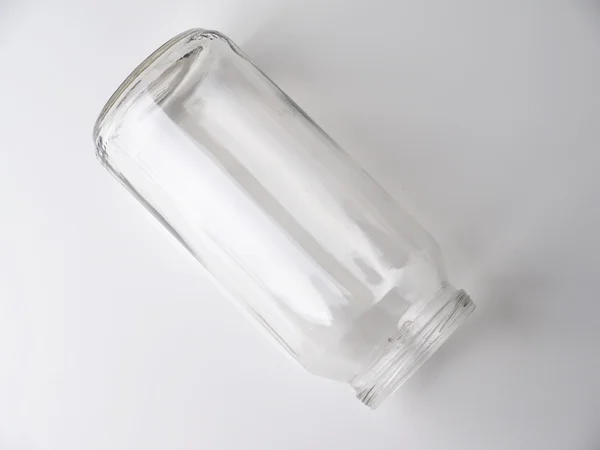 Jarra de vidro em um fundo cinza — Fotografia de Stock