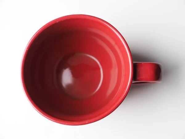 Taza roja sobre un fondo claro —  Fotos de Stock