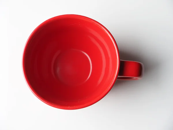 Taza roja sobre un fondo claro —  Fotos de Stock