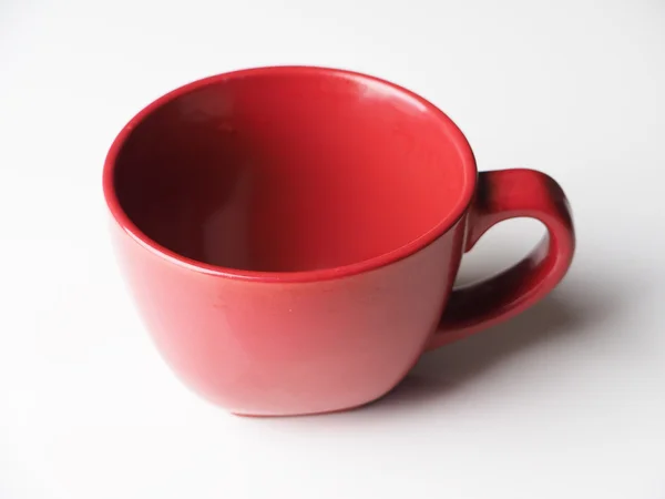 Taza roja sobre un fondo claro —  Fotos de Stock