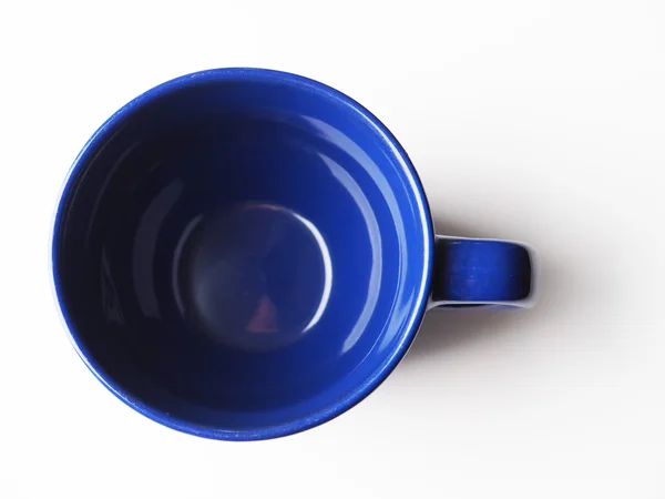 Blauwe cup op een lichte achtergrond — Stockfoto