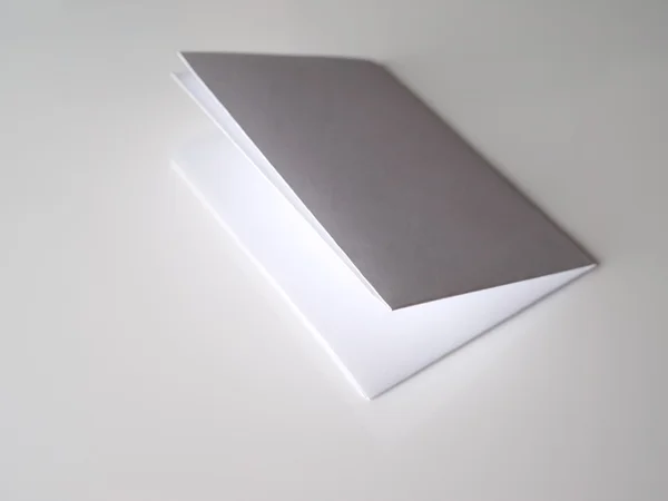 Folded paper on a gray background — Stock Photo, Image