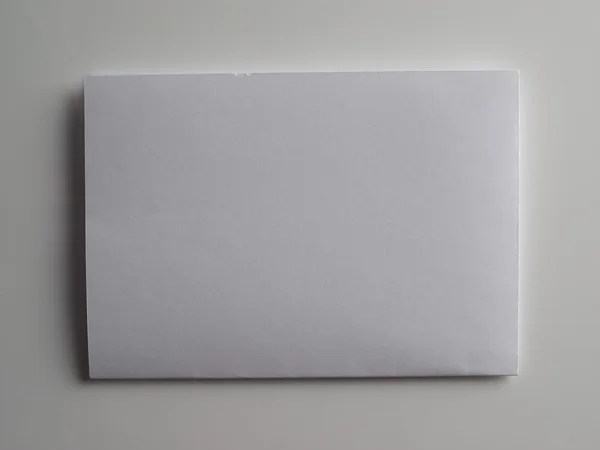 Carta a4 su fondo grigio — Foto Stock
