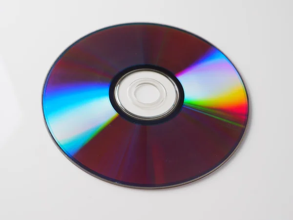 Disco de DVD em um fundo cinza — Fotografia de Stock