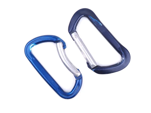 Blauw karabiners klimmen op een witte achtergrond — Stockfoto