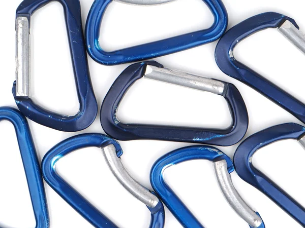 Blue climbing carabiners on a white background — Stock Photo, Image