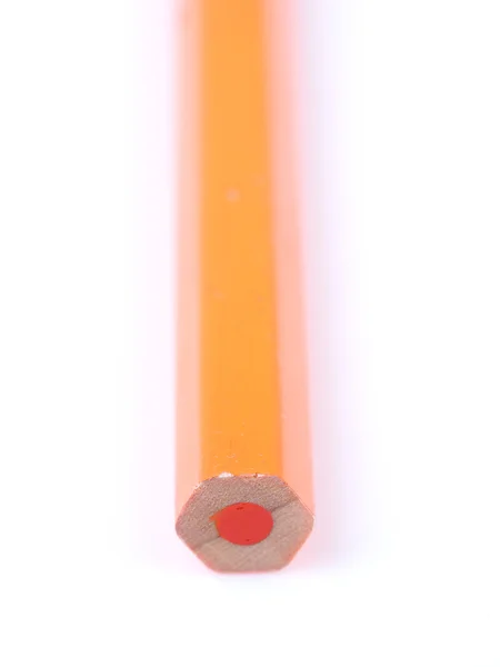 Lápis laranja sobre um fundo branco — Fotografia de Stock