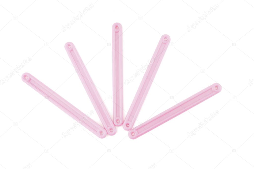 pink counting sticks on a white background