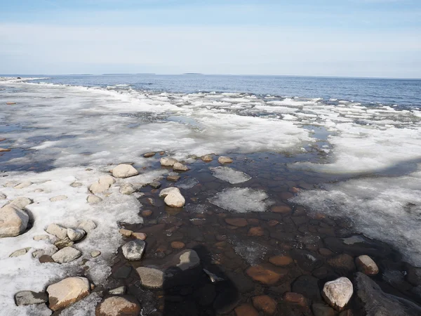 Stones and ice on the lake — Stock Photo, Image