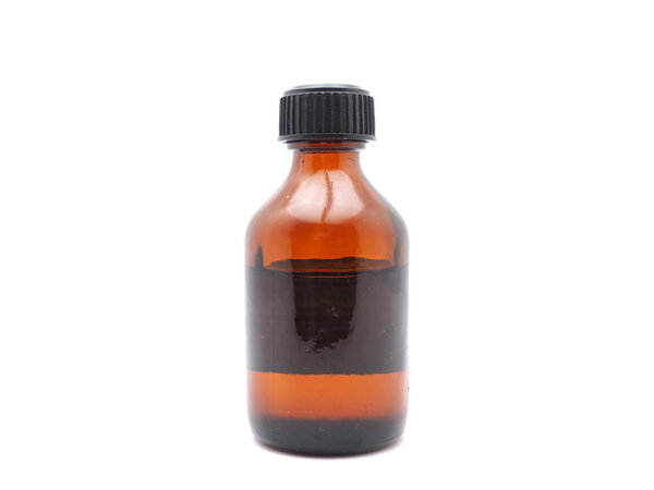 Medicine bottle of brown glass isolated on white background