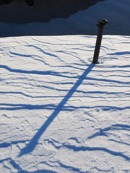 Rusty pipe in the snow — Stock Photo, Image