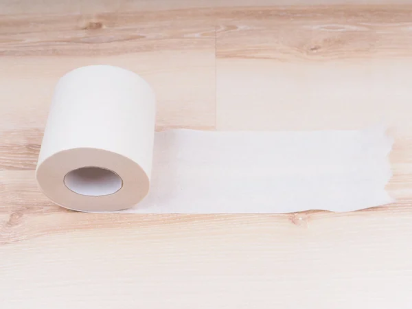 Toilet paper on wooden background — Stock Photo, Image