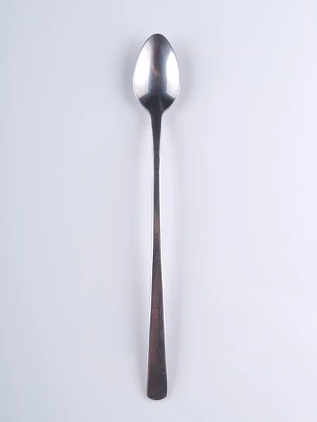 Cucchiaio su sfondo grigio — Foto Stock