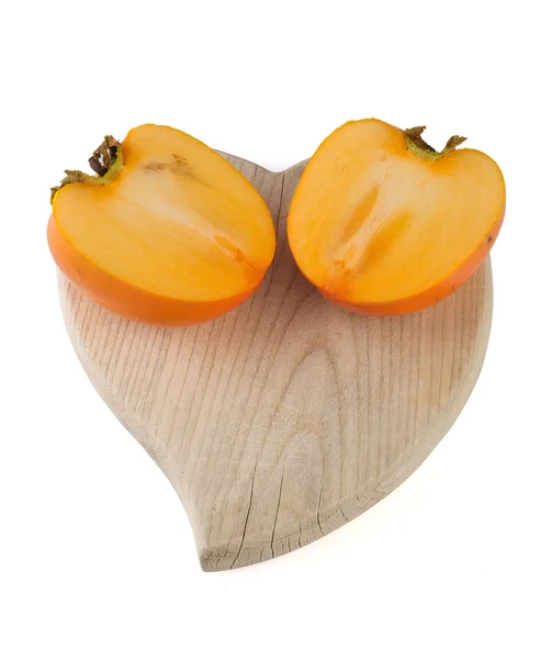 Persimmon and cutting board — Stock Photo, Image