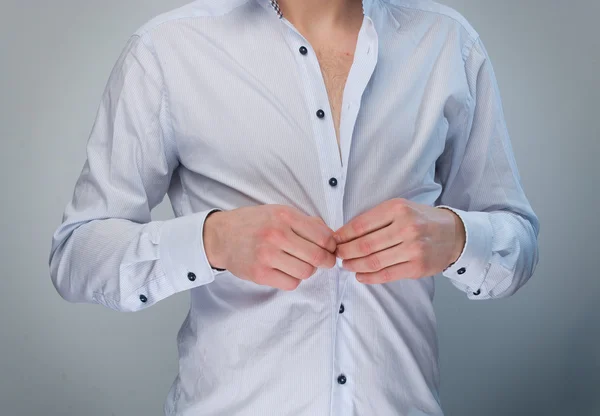 Man adjusting his shirt buttons. — Stock Photo, Image