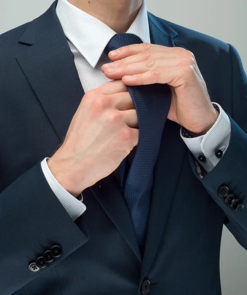 Manos y Cravat Imagen de stock