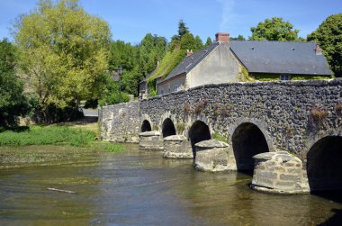 Old bridge at Asnières sur Vègre in France