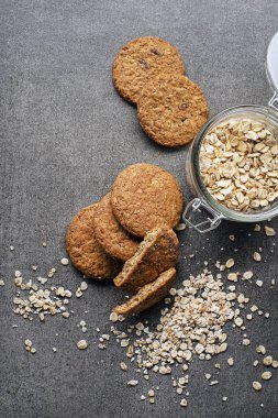 Homemade oatmeal cookies on grey table background. Healthy Food Snack Concept