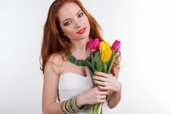 Pretty girl with bouquet of colorful tulips — Stock Photo, Image