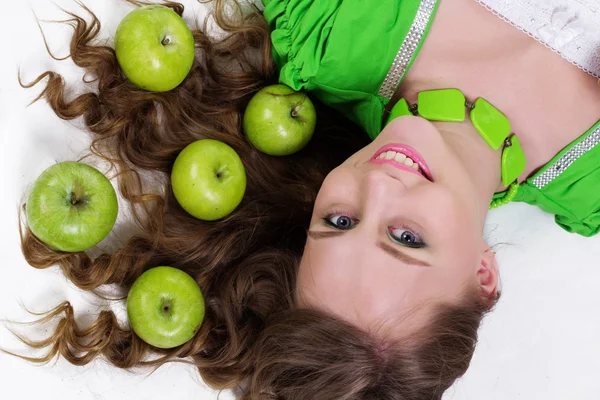 Smiling girl with appetizing apples, healthy food — Stock Photo, Image