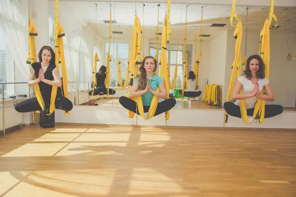 Group of women doing meditation in hammocks — Stock Photo, Image