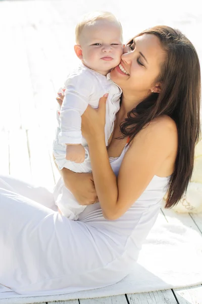 Mom and little child boy are wearing white clothes — Stock Photo, Image