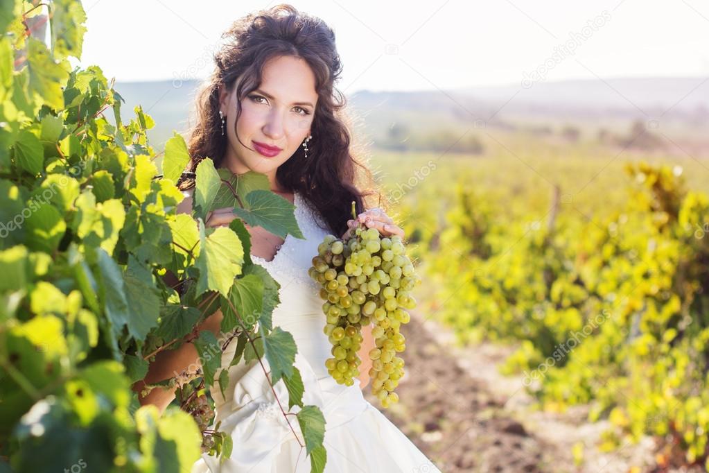 Bride in a vineyard, autumn