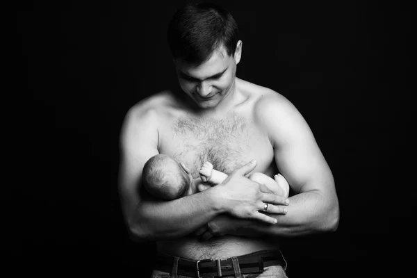 Infant baby boy on his father's arms — Stock Photo, Image