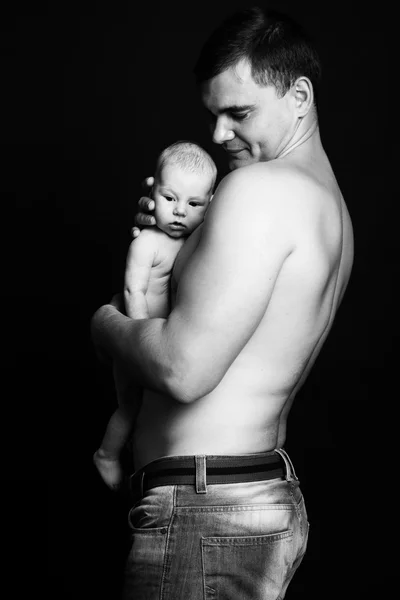 Infant baby boy on his father's arms — Stock Photo, Image