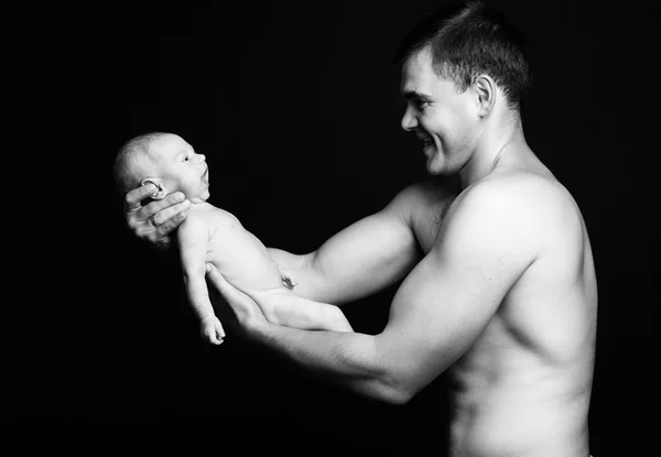 Infant baby boy on his father's arms — Stock Photo, Image