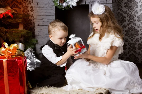 Happy children with christmas presents — Stock Photo, Image