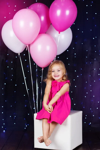 Little girl with pink balloons — Stock Photo, Image