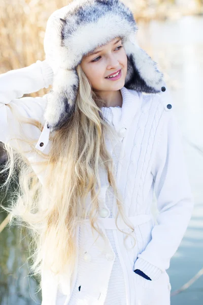 Cute little girl in winter clothes outdoors — Stock Photo, Image