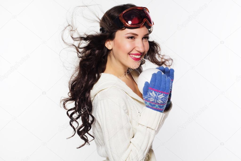 Woman with ski goggles isolated on white