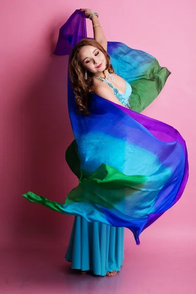 Beautiful belly dancer wearing a blue costume — Stock Photo, Image