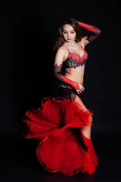 Beautiful belly dancer wearing a black costume — Stock Photo, Image