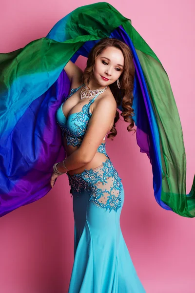 Beautiful belly dancer is wearing a blue costume — Stock Photo, Image