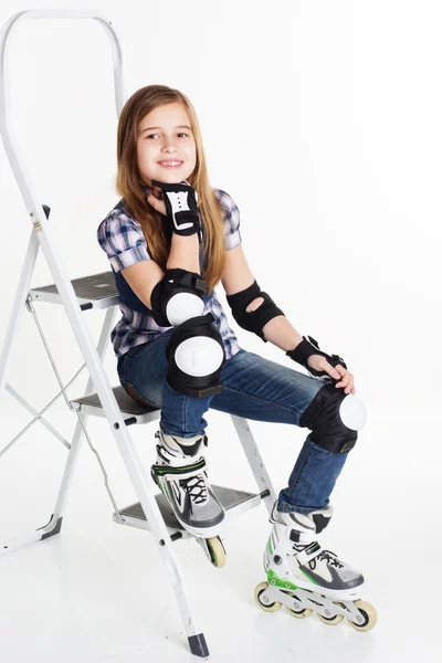 Girl in roller skates isolated on white background — Stock Photo, Image