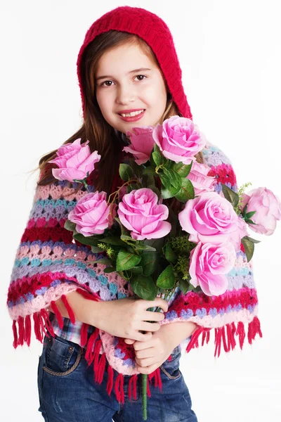 Little girl holding a bouquet of red roses — Stock Photo, Image