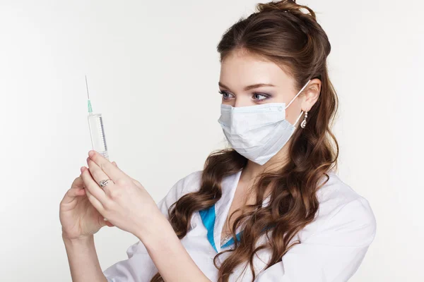 Young intern with syringe isolated on white background — Stock Photo, Image