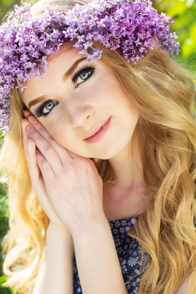 Portrait of beautiful teen girl with wreath from lilac flowers — Stock Photo, Image