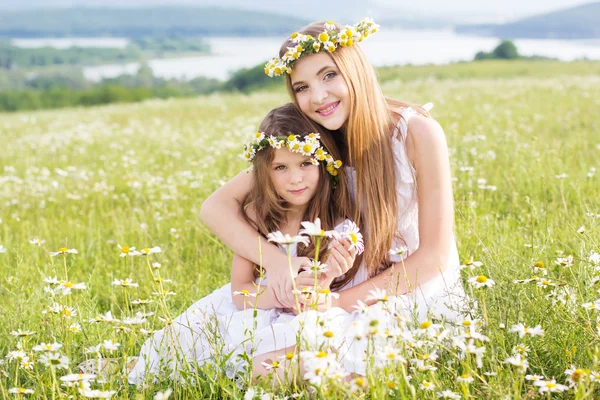 Two child girls at field with mountains view — Stock Photo, Image