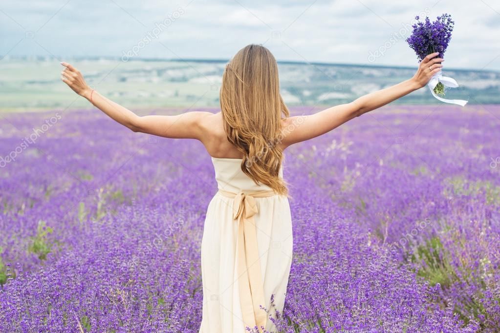 Back view of girl at purple lavender field