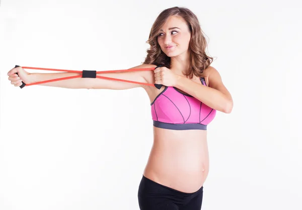抵抗バンド チューブとスポーツをして妊娠中の女性 — ストック写真