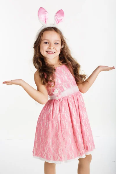 Child girl with pink ears bunny on white background — Stock Photo, Image