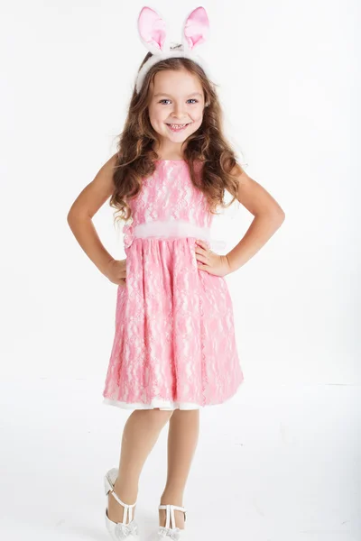 Little girl with pink ears bunny on white background — Stock Photo, Image