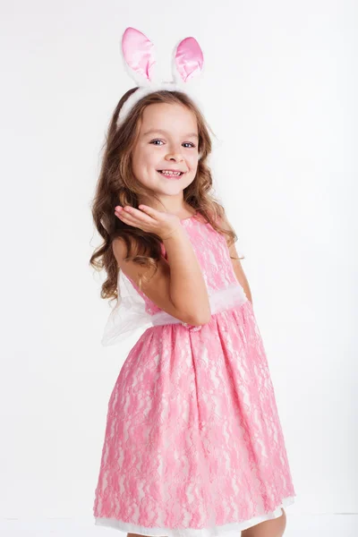 Happy child girl is wearing pink bunny ears — Stock Photo, Image