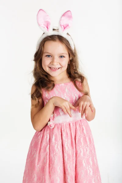 Child girl is wearing pink bunny ears — Stock Photo, Image