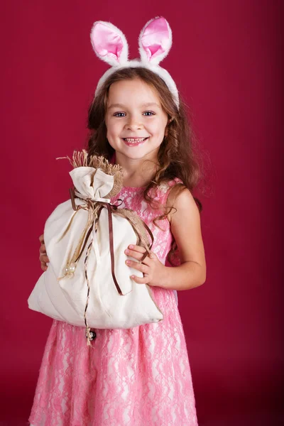 Child girl is wearing pink ears, christmas time — Stock Photo, Image